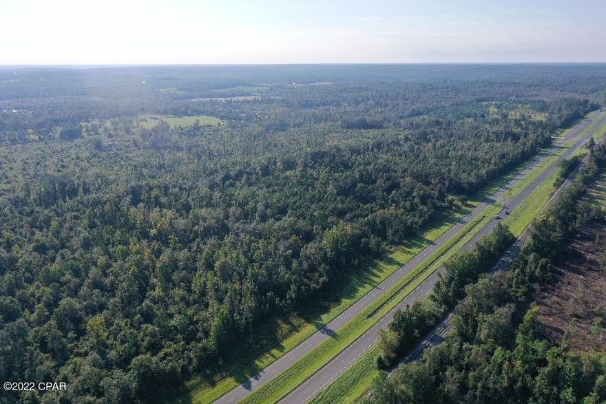 With about 1,300 ft of HWY frontage along 231, this 36 acre parcel has many possibilities.  Several uses can be had on this high and dry parcel that also joins Mills Rd to the South.  Located only 40 minutes from the ''Worlds most beautiful beaches'' in Panama City, this property has endless uses.   Call today for your appointment.