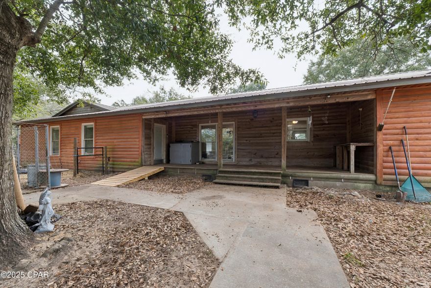 Charming Log Cabin style home on 1 Acre (fenced in) located in Fountain, FL. 

Escape to the peace and quiet of country living with this beautiful log cabin-style home nestled on a spacious 1-acre lot. Ideally located between Highway 20 and Interstate 10, this property offers the perfect blend of privacy and convenience.
 Inside you will find 3 bedrooms and 3 full bathrooms, providing plenty of space for family and guests. Projector mounted in the open living area takes watching movies or sports to another level. Enough parking and inside space to host all family functions. The warm wood tones, rustic charm, and open layout create a cozy, inviting atmosphere that makes you feel right at home. Whether you're relaxing on the porch with your morning coffee or enjoying evenings surrounded by nature, this home is rural Florida living just outside of the city.
If you love the country lifestyle, you won't want to miss this. A space, that offers room to breathe, unwind, and make lasting memories.