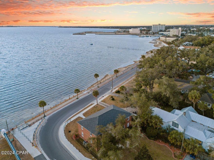 Currently under contract - seller accepting back up offers. A truly unbelievable RARE opportunity to own a multi-family QUAD that is waterfront in the historic Cove neighborhood awaits. This quad-plex sits on the corner of Beach Drive and Cherry Streets and boasts the most incredible sunsets in Panama City, Florida! 

This multi-family home is comprised of four units, all of equal size, and has 2 bedrooms, 1 bath in each as well as their own stackable washer/dryer in each unit. Each unit is metered separately for water, sewer and electricity making it an easy income-producing investment. The property offers parking in the back of the home and is large enough to add a pool which would create an even more profitable investment! Imagine the guests and tenants that would rent a historic waterfront unit this close to the fast-growing Downtown District of Panama City! With the notoriety of the historical landmark of ''Bunkers Point Building'' by the Historical Society of Bay County, this is sure to be a draw for guests and tenants alike! 

The property offers little to maintenance, as well. The home had a new roof installed in November 2018 and each unit had new appliances, hot water heaters, HVAC and stackable washer/dryers in 2019. 

This property located in the heart of the Cove and adjacent to Downtown Panama City offers walkability to restaurants, shopping, farmers markets, festivals and more! Watch the fireworks for July 4, take waterfront strolls along Beach Drive and sit in your front yard enamored with the shimmering water views of St. Andrews Bay! 

This property is zoned MU-3 providing many possibilities for a buyer. Currently being used a long term rental, short term rentals ARE ALLOWED and gives a savvy investor the opportunity to increase rents and maximize the return on this waterfront gem! Other uses for MU-3 include but are certainly not limited to: bed and breakfasts, private school, professional offices, grocery and convenience retail store, food establishment and so much more! Please see the City of Panama City for full zoning information. 

Two of the units can be accessed from the ground level and two of the units can be accessed from the second level. Each unit is single level throughout. The units each have a bedroom and living room that face the beautiful waterfront. There is a kitchen, bedroom and bathroom overlooking the lush landscaping and hundred year old oak trees in the back yard. The dining room is conveniently located in the center of the unit and makes for a great open layout! 

This is an amazing opportunity for an investor looking to expand their multi-family portfolio, a professional looking to create an office in a neighborhood and have income producing units above, or an individual looking to live in one unit and rent the other three year-round.

The possibilities are ENDLESS with this waterfront multi-family QUAD!