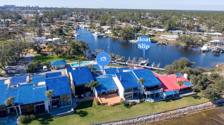 Stunning piece of paradise with your very own deeded boat slip w/boat lift! This immaculate town home is everything you need to enjoy life on the water. As you walk into this home you'll immediately notice the  spacious & open floor plan, updates throughout, & the amazing water view. The Kitchen boasts granite counter tops, double ovens, stainless steel appliances, & plenty of  cabinet & counter space. The master bedroom is impressive with french doors & a bathroom fit for a king! Relax in the huge jetted tub & enjoy his & hers closets. The second bedroom boasts a large walk-in closet & a private patio your guests will love! Town-home has an attached oversized one car garage that's perfect for storing all your water toys. So much to offer and comes fully furnished