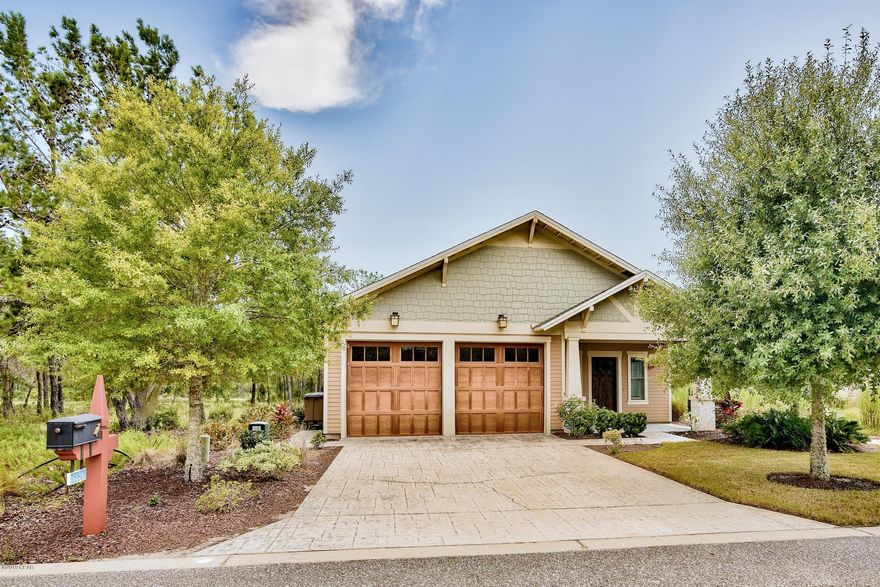 Looking for a private oasis to call home with luxurious amenities at your fingertips including access to serene Lake Powell, a lakeside pool and fire pit, nature trails and Greg Norman designed Shark's Tooth Golf Course? This terrific 1,505 sq ft 3-bedroom, 2-bath home is located on the third fairway of Norman's Shark Tooth Golf Course in Wild Heron, a prestigious gated golf community.  The home has a beautiful paver stone entry and driveway with a 2-car garage. Upon entry you are greeted with custom hardwood floors throughout the main living areas & tile floors in the kitchen and bathrooms. The home is beautifully designed with tray ceilings in the living room, great room and master bedroom. The luxurious en-suite master bath features a double vanity with granite countertop & soaking tub. The elegant double doors of the great room lead out to the tranquility of the enclosed patio, the perfect spot for entertaining outdoors or just relaxing with a good book while enjoying the serenity of the lush, natural surroundings. These doors can also be closed off for added privacy. Beautiful craftsman details like the wainscoting, trimmed windows & doors and wood lined trayed ceilings truly make this home exquisitely unique. The open kitchen features a large granite breakfast bar great for casual dining and is accented with pedestal lights. There are top of the line, stainless steel Bosch appliances, ample hardwood cabinets, recessed lighting and custom tile backsplash. There is a dining area for a more formal setting. The master suite is quite spacious with an en-suite bathroom and there are two guest bedrooms with an additional bath. The home has been well maintained and will be a fantastic full time residence or second home in one of the most unique and beautiful communities in Panama City Beach. Full size washer & dryer is negotiable. 

Residents of Wild Heron have access to the community boathouse which offers complimentary kayaks to explore pristine waters of the preserve. Keep fit with tennis courts and a fully equipped fitness center on-site. Afterwards, enjoy a relaxing dip in the lakeside community pool and/or hot tub. You have access to two pools for your enjoyment. Golfers of all skill levels will enjoy the Greg Norman designed Shark's Tooth Golf Club course which was awarded Silver Signature Sanctuary Status by Audubon International for its commitment to environmental excellence. After a game of golf, head over to the clubhouse bar and grill to unwind with some drinks and good food. As if all of the Wild Heron amenities were not enough, Panama City Beach attractions are less than 15 minutes away!