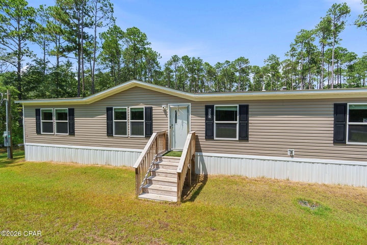 Photo 1 of 31 — 513 Shadow Lane, Freeport, FL 32439