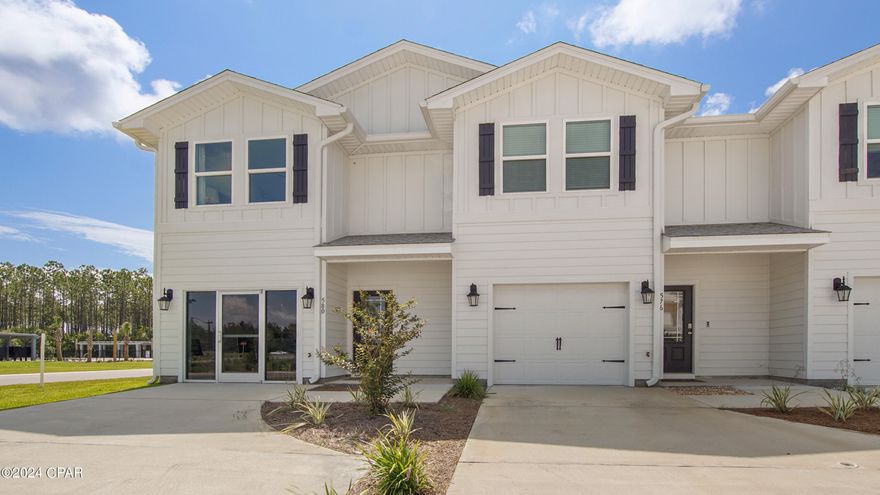 Bayside at Ward Creek is at the heart of Panama City Beach, accessible by sidewalk to Pier Park, Frank Brown Park, and the Conservation Park with the Gulf of Mexico less than 3 miles away.  | This townhome features the Palm Floor Plan with 3 bedrooms, 2.5 bathrooms, and a 1-car garage. The driveway is widened allowing 2 vehicles to fit side by side behind the single car garage.  All bedrooms are located on the second floor, leaving plenty of space on the main level for entertaining and relaxing. Beautiful interior features in this unit include bright white cabinetry in Ivory, granite countertops, a center island with stainless-steel sink, and stainless kitchen appliances which include a stove, microwave, and dishwasher.