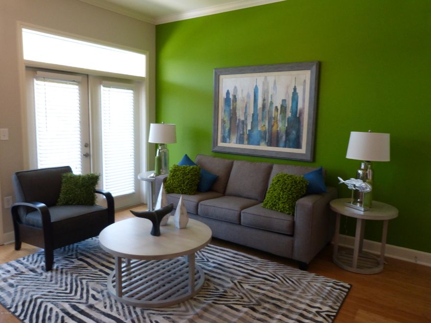 A MUST SEE! Beautiful two bedroom condo professionally decorated and furnished.  This condo is just steps from the 3rd floor garage in desirable Island Reserve.  Completely furnished with a contemporary flair with over $8,000 in upgraded appliances and MOVE IN READY. This two bedroom condo has an open floor plan with 10 ft. ceilings, crown molding, granite counter tops, and new stainless steel appliances. Enjoy resort style living with a one acre lagoon style pool with rock waterfall, fitness center, game room, theater, basketball court and conveniently located to shopping, restaurants, and the beach.  Age, sq. ft., and room sizes are approximate.  Please verify if important.