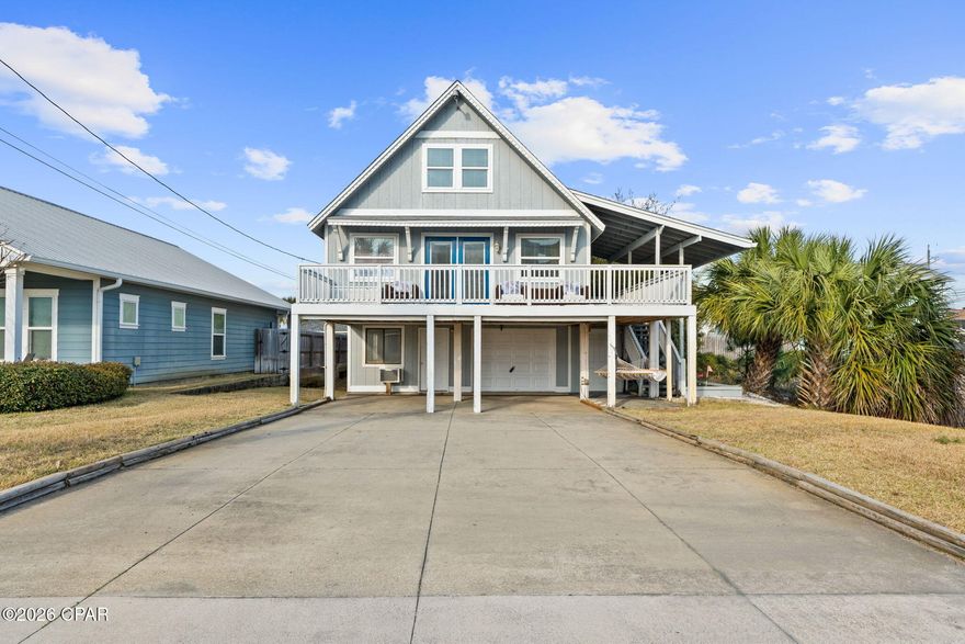 Welcome to 6120 Beach Drive - your chance to own a versatile beach retreat on the peaceful east end of Panama City Beach.

This elevated coastal home offers the perfect blend of personal beach living and income potential, just moments from the Gulf. Upstairs you'll find a bright and inviting main living space featuring an open layout, spacious kitchen with island seating, durable flooring, and abundant natural light. Step outside to the large covered deck, the ideal spot for morning coffee, evening drinks, or simply relaxing in the coastal breeze after a day on the water.

What truly sets this property apart is the fully separate 1 bedroom, 1 bathroom apartment located downstairs. With its own living space and private feel, this setup creates an excellent opportunity to generate rental income, host guests, or create a private retreat for extended family and friends. Whether you're looking for a vacation rental investment or a beach home that helps offset ownership costs, this flexible layout offers options buyers love.

The property also features ample parking, covered space, and a fun backyard putting green area, making it perfect for entertaining after a day at the beach.

Location is everything, and this home puts you right in the heart of the laid-back East End beach lifestyle. You're just minutes from some of the area's most loved destinations including Schooners Beach Club, public beach access points along Thomas Drive, and the natural beauty of St. Andrews State Park with its miles of shoreline, boating, fishing, and wildlife. Enjoy quick access to local restaurants, beach bars, marinas, and entertainment, while still enjoying a quieter side of Panama City Beach away from the heavy traffic of the west end.

Whether you're searching for a smart investment opportunity, a second home near the Gulf, or a full-time coastal escape, this property delivers the flexibility and location to make it happen.

Beach life, income potential, and the best of the East End -- all in one property. Come see it today!