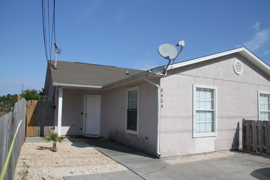 Freshly painted and updated kitchen counters with granite - plus brand new stainless appliance package..  New flooring in both bedrooms and new lighting and ceiling fans.  You can walk to the beach and store your beach toys in the yard building.  2 parking places - a perfect room mate plan.  1 Pet - canine breed under 30 lbs may be considered upon landlord approval of the breed. Monthly pet rent required and a non-refundable pet cleaning fee upon approval.