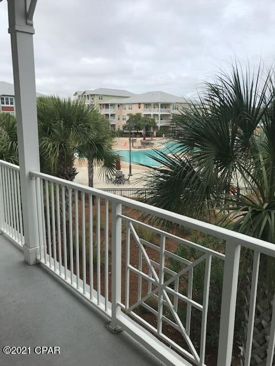 Enjoy a Great View of the Pool and Amenities on this second floor corner balcony!  This three bedroom, 2 1/12 bath unit is move-in ready.  A/C and hot water new (1 yr). This unit boasts of 10' ceilings, granite countertops, stainless steel appliances, and bamboo floors. Amenities include tropical landscaping, one acre resort style lagoon pool with waterfall, spash pad and hot tub, serene courtyard fountains, fitness facility, basketball/pickleball court, community room with pool table, parking garage with access to each floor, and elevator. Close proximity to shopping, restaurants and beaches. Perfect for homeowners and investors. A great place to live. Title Company is Mason Title & Escrow, 11501 Hutchison Blvd. Suite 107, PCB, FL 32407, Kathy Prumatico, 850-236-9090, kprumatico@masontitle.com.