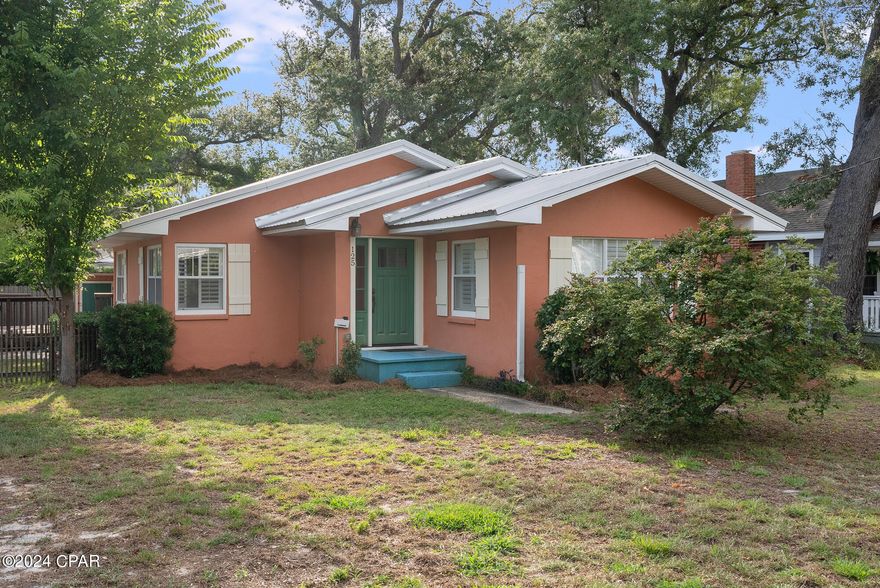 This Cove Charmer sits on a corner lot in the one the prettiest areas in the Cove. The living area has beautiful wood ceilings that really stand out along with the plantation shutters throughout the home. Home was just painted on the interior after the seller moved out and a professional cleaning was done. 
The kitchen has solid wood cabinetry and newer stainless appliances including a Kitchen Aide downdraft stove.
The spacious master bedroom has a large walk in closet and the bathroom has double vanities. One of the bedrooms does not have a closet and will require a armoire, it will make a great nursery or office. 
The side porch deck offers the perfect spot to enjoy morning coffee or evening cocktails while overlooking the spacious yard. New trees have been planted, adding to the beauty of the landscape, and a shed provides convenient storage for outdoor essentials.
The home has been well maintained and has a new HVAC unit, new metal roof in 2019, new plumbing pipe from the road to the house, new electrical panel, and is covered with a termite bond. 
Join a vibrant community of residents who appreciate the charm and beauty of Cove living. From outdoor adventures to local festivals and events downtown, a 5 minute bike ride away, there is always something to see and do in this idyllic neighborhood.