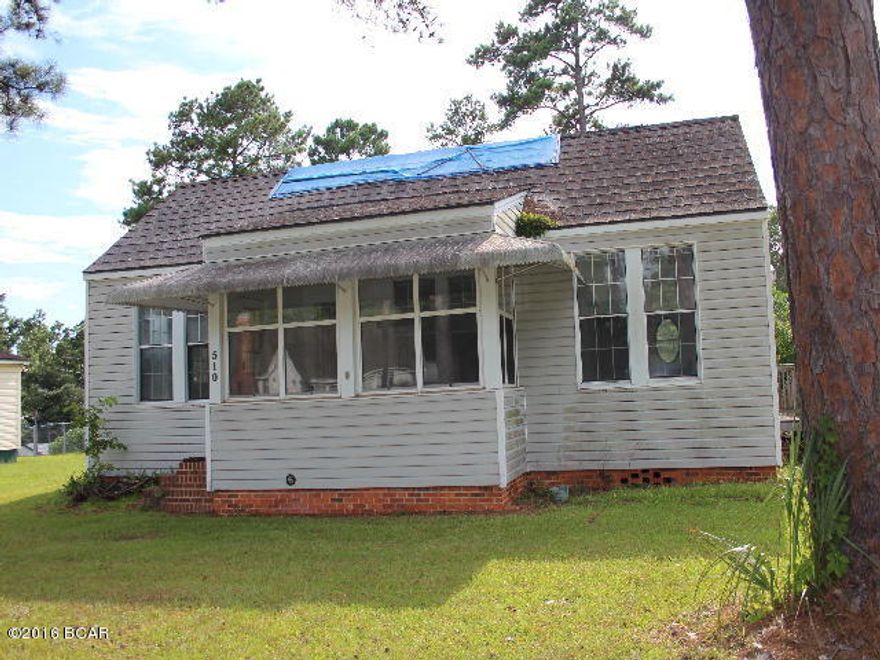 Cottage style home just waiting for someone to bring her back to her potential. Interior needs complete renovations but this is a great investment property! It has 3 bedrooms and 2 baths, one of which needs installation. There is an enclosed sun porch and there is a large detached garage/workshop. The side entrance is handicap assessible.