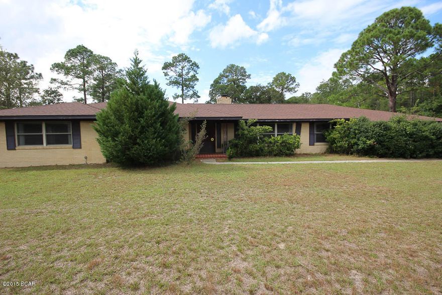 TWO CONTRACTS ARE BEING NEGOTIATED NOW, WILL BE PENDED WITH A DAY. THIS LARGE SINGLE STORY HOME IS LOCATED NOT FAR FROM 23RD STREET AND DOWNTOWN PANAMA CITY. THE HOME IS LOCATED ON A LARGE 1.2 ACRE LOT, SO THERE IS PLENTY OF ROOM FOR JUST ABOUT EVERYTHING. HOME ITSELF HAS TREMENDOUS POTENTIAL WITH ALL BRICK EXTERIOR AND SOME NEWER WINDOWS AND ARCHITECTURAL S IT APPEARS INSTALLED.THERE ARE SOME DECORATIVE STONE WALLS INSIDE WITH REAL HARDWOOD FLOORING THROUGHTOUT THE FORMAL DINING, LIVING ROOM, LARGE FOYER AND DEN AREA. FIREPLACE IN THE LARGE DEN AND GRANITE TOPS IN THE KITCHEN. ON THE BACK OF THE HOUSE IS A LARGE SUNROOM OVERLOOKING THE EXPANSIVE BACKYARD. BUT HERE IS THE KICKER ON THIS HOME---YOU HAVE A LARGE THREE BAY DETACHED GARAGE WITH HIGH DOORS FOR ANY CAR/TRUCK ENTHUSIAST.