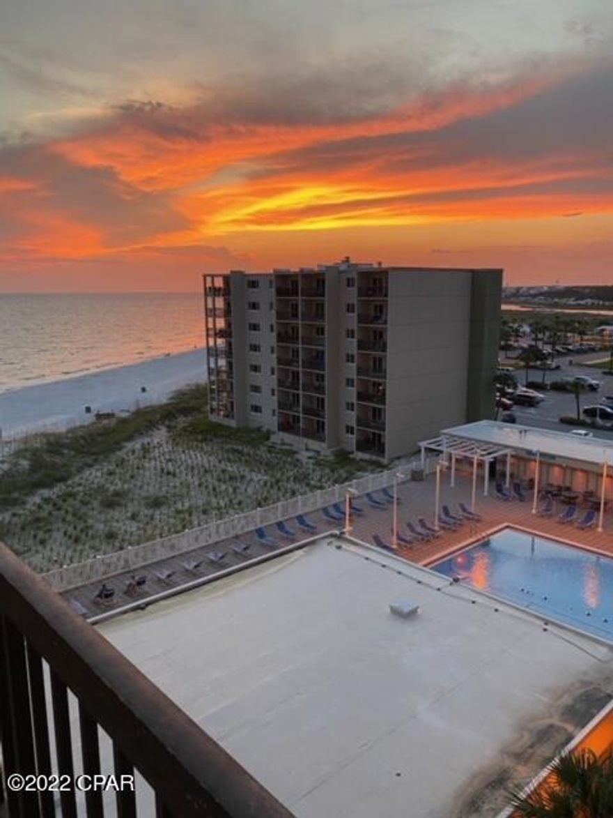 CURRENTLY UNDER CONTRACT, SELLER WILL CONSIDER BACKUP OFFERS'  Double Gulf views and Spectacular sunsets from this 5th floor unit!  Decorated in fun, bright, beachy colors and décor, this two bedroom, 2.5 bath unit has an updated kitchen with a unique granite countertop and a new stove and microwave.  The downstairs level has new tile, and a living room balcony overlooking the Tower's pool deck, the beach and the Gulf.  The stairs leading to the second level have wooden stair treads and the stairwell itself has been opened up to give a more spacious and light-filled stairway.  The second level features ceramic plank flooring in both bedrooms and baths. The guest bedroom has a picture window view of the same view as the living room.  The hall guest bath has a new vanity and sink and a large tiled shower.  The Master bedroom has a large balcony overlooking the beach and the Gulf.  The en suite master bathroom with a tub/shower combo has a new sink and vanity.   Pinnacle Port Resort is situated on a 25+ acre site within a beautiful gated community having over ¼ mile of beach frontage!  The complex has lots of amenities including two swimming pools, tennis courts sauna/steam room, fitness room, its own private freshwater dock with boat slips boat launch and wi-fi.   Please note that the Association fees include electricity for heating, cooling and hot water.  The owner pays a small electricity bill for lighting and appliances only.  Note:  There is possible owner financing with a substantial downpayment.