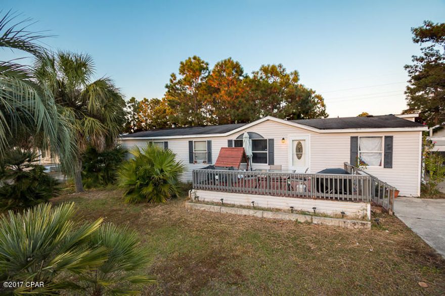 If you're looking for a spacious home in a quiet subdivision without paying HOA fees you need to see this property. Nestled away in the subdivision of North Lagoon Oaks boasting over 1,500 sqft, this 3 bedroom/2 bath home awaits you. Just walking distance to great schools and conveniently located close to shopping, restaurants, and the World's Most Beautiful Beaches, you couldn't ask for a better location.

 When you walk in the front door you will immediately notice vast amount of space this home has to offer. Enjoy gatherings with friends or family in the large family room. The living room invites comfort with its wood burning fireplace, perfect for spending your evenings. The master bedroom connects to the open master bathroom featuring a double vanity, stand up shower, and a huge garden tub. You'll love having a kitchen this size with plenty of counter space and cabinets; your inner chef is bound to come out. Next to the kitchen you'll see the separate laundry room that leads to the huge fenced in back yard. Enjoy your morning coffee on your large front porch or go for a stroll on the neighborhood walking path that is accessible through the back gate. You don't want to miss the chance to own this affordable home!