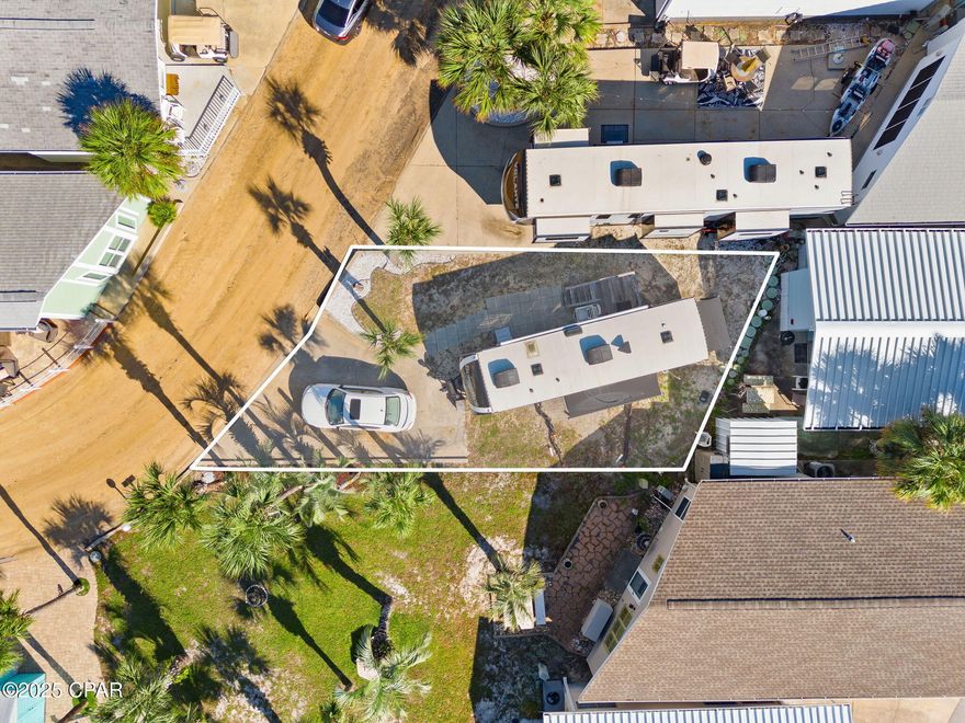 Don't miss your chance to own a premium lot in the highly sought-after Venture Out community! Whether you're ready to build your dream beach home or looking for the perfect spot to park your RV or boat, this lot offers exceptional flexibility and value.
Located on a quiet street and adjacent to common area, this property provides additional privacy and outdoor space—ideal for relaxing or entertaining. RV does not convey with lot.  Venture Out is a gated, golf cart-friendly community with 300' of Gulf frontage and 1,000' on Grand Lagoon. Amenities include two swimming pools, a fishing pier, private boat launch, mini golf, playground, and 24-hour security.

Perfect for full-time living, vacation use, or investment potential—don't miss your chance to be part of this growing coastal community!