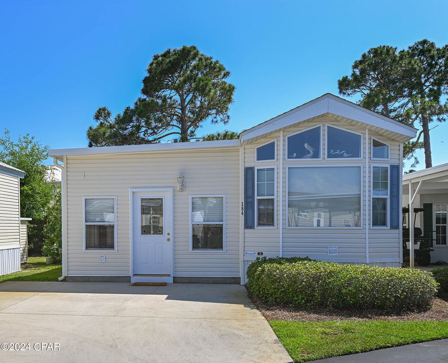 ***UNDER CONTRACT, SELLER WILL CONSIDER BACK UP OFFERS** Want an affordable vacation home just around the corner from St. Andrew's Beach State Park?  What an opportunity to have your own slice of paradise with all the amenities including two pools, a hot tub, shuffle board, club house with fitness center, meeting rooms for social activities and a stocked lake all within a few miles of the Gulf of Mexico.   You'll have quick and convenient access to St. Andrew's State Park or any of the of the shopping, entertainment, restaurants and medical facilities that Panama City Beach offers.  Brand new HVAC was installed July of 2022, it was just serviced and includes a free service again on 11/11/24.  The house comes fully furnished and rental ready with a beach decor to appeal to vacationers.  With the gated access to the community, you will have peace of mind knowing that you are safe and secure and that the community is always a quiet and peaceful community.  HOA fee includes trash pickup, water & sewer, pest control, lawn care, cable TV, wifi is available in the club house, fitness center, club house for social events and private gatherings, shuffle board, two pools, hot tub, stocked lake for catch and release, boardwalk and HOA accounting.