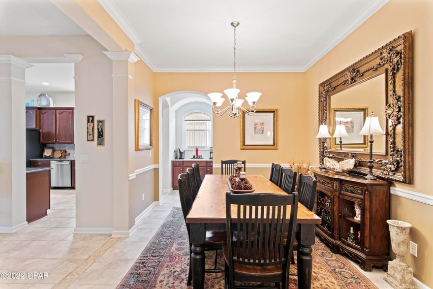 Immaculate Home Located In The Highly South After Community Of Palmetto Trace! This Amazing 3BR/2.5 BA Home With Office Is Perfect For Those That LOVE Entertaining!  Large Sliding Glass Doors Lead You To the Incredible Back Yard Featuring Newly Built Oversized Screed In Lanai With Beautiful Pavers Surrounding The Newly Installed Grecian Style Gunite Pool Making Outdoor Living A Breeze.  Additional Exterior Features & Updates Include: New Vinyl Fencing Enclosing Entire Back Yard, Custom Built Outbuilding, New Sod & Irrigation For Entire Yard, 7 New Palm Trees, Exterior Painting, Large Lot Overlooking Stocked Pond Feed By Natural Spring.  The Interior Offers 10ft Ceilings, Open Spilt Floor Plan, Spacious Gourmet Kitchen With 42'' Solid Wood Cabinetry, Tile Backsplash, Granite Countertops, Brand New GE Profile Stainless Appliances, Breakfast Bar & Eat-In Kitchen, Butlers Pantry & Stunning Tile Flooring.  Primary Suite Has Garden Tub, Separate Shower & Double Vanity.  All This Only A Short Distance To Pier Park Which Is Loaded With All The Shopping, Restaurants & Entertainment Anyone Could Ask & The Amazing Beaches Of Our Emerald Coast!