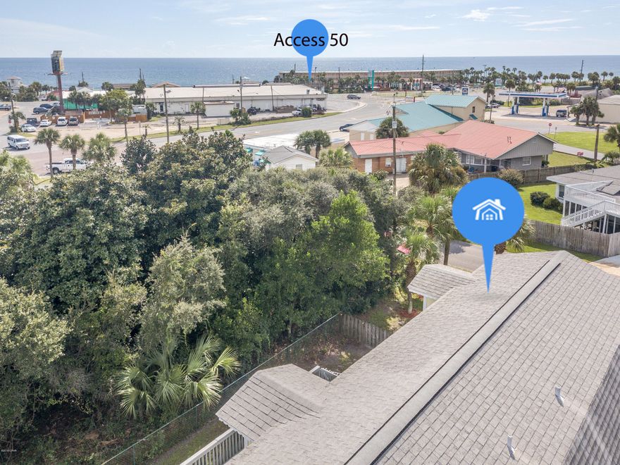 This uniquely shaped beach home is move in ready! Enjoy the spacious wrap around porch, especially on a breezy evening with a view of the spectacular skyline of the Gulf of Mexico. A short two block walk to the beach or drive to fabulously close attractions and restaurants. With so much going on around you, don't forget to enjoy this home, it boasts a total of 3,638 square feet. The ground level has an oversized double garage with a workshop. The second floor includes the main living area, kitchen, and master bedroom with a full bath. On the top floor there are 2 bedrooms and another full bath. The front bedroom has a balcony where you can watch the sunsets and enjoy a view of water. The back yard is fenced- big enough for a pool and includes a storage building. Age, Square Footage, lot and room sizes approximate, if important please verify.