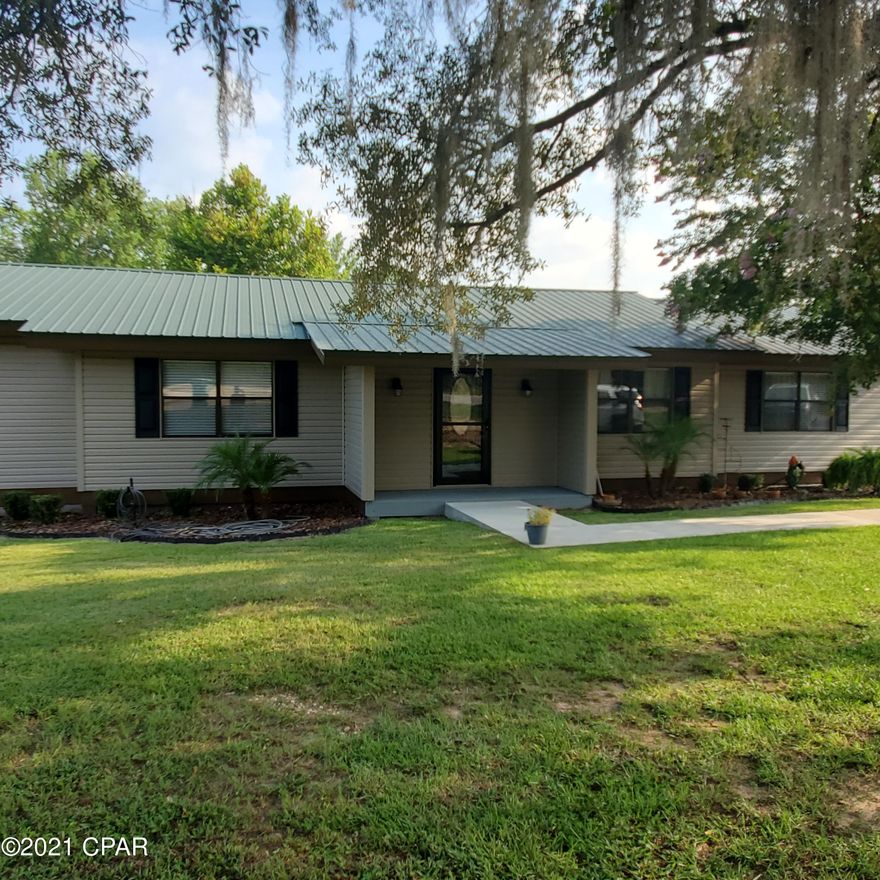 This Beautiful 2208 Sq Ft Home won't last long!  Split Floor Plan with Open Living Dining and Kitchen.  Separate Family Room with stone Fireplace and deck for enjoying the evenings.  Large Open Kitchen with Corian Counter tops, stainless appliances and beautiful cabinets.  Beautiful Dining Area in the open Living Space.  Large Master Bedroom with Tile Shower and double vanity.  Large Laundry Room .  Walk out on the back deck and enjoy your beautiful above ground pool!  Want the country life?  This fenced yard has space for a garden and there is already a place for your chickens.  The large separate garage is also a workshop / barn.  Just over 1 Acre lot with no close neighbors for all the privacy you need. Enjoy the amenities of Compass Lake with Restaurant & Public Boat Ramp to lake.