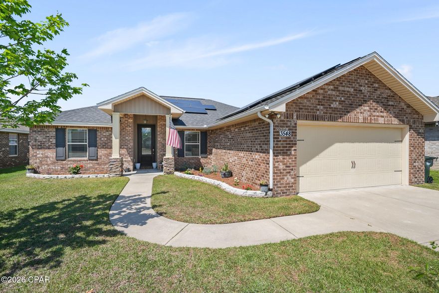 PRICED FOR A QUICK SALE! Located in the desirable Azalea Place subdivision in Lynn Haven, this all brick home offers convenient access to schools, main shopping areas, Tyndall Air Force Base, and the Naval Coastal Systems Base. This home is less an 10 miles to Downtown Panama City and approximately 15 miles to the emerald shores of Panama City Beach. 

Inside, the home features an open living and dining layout designed for both everyday living and entertaining. The living room is anchored by a fireplace, creating a warm and inviting focal point. The kitchen is well equipped with granite countertops, custom built cabinetry, stainless steel appliances, and a breakfast bar that adds additional seating and functionality. Durable wood look flooring runs throughout the main living areas, complemented by updated lighting, recessed lighting, crown molding, and detailed wall trim accents.

The primary suite offers a tray ceiling, double vanities, a walk in closet, and a separate tub and shower for added comfort. A glass front door creates a beautiful first impression, while French doors lead to the screened back porch, extending your living space outdoors.

Exterior features include a two car garage, covered front porch, screened back porch, fully sodded yard with an irrigation system, and sidewalk frontage. The backyard includes fruit trees, adding both charm and function to the outdoor space. The home is also equipped with solar panels, offering potential energy efficiency benefits.

Contact a REALTOR today to schedule a private showing. Buyer to verify all measurements and information deemed important.