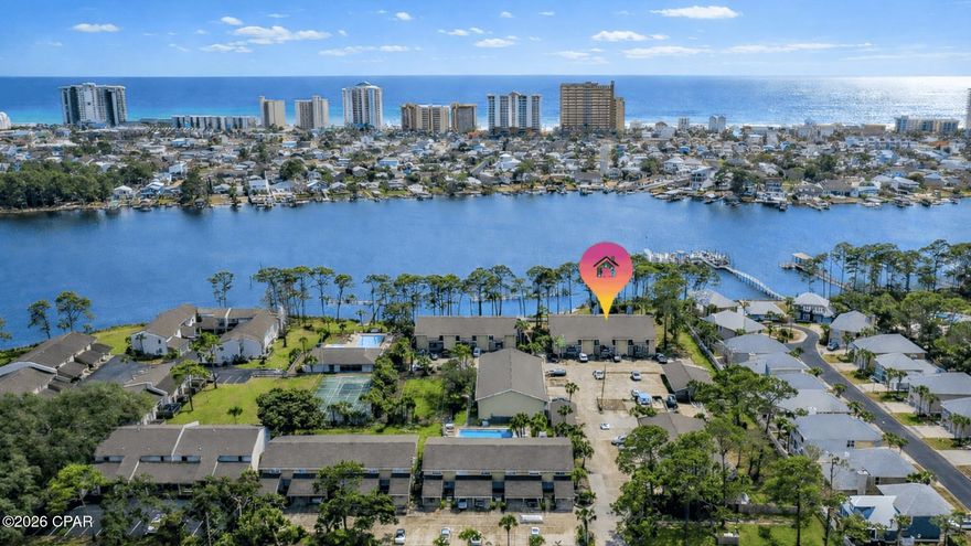 Waterfront living at Grand Lagoon Cove! This 2BR/2BA lagoon-front condo offers direct water views, dock access, and a rare opportunity to own in one of North Lagoon's true waterfront communities. Enjoy peaceful mornings from your covered balcony overlooking the lagoon and green space. Community amenities include a pool, tennis courts, and shared dock access (slip use subject to HOA rules and availability). Recent updates include LVP flooring, stainless appliances, water heater replaced October 2025, and HVAC replaced in 2013. Short-term rentals are permitted per association guidelines. Conveniently located near beaches, marinas, dining, and St. Andrews State Park. Grand Lagoon Cove is a true lagoon-front community offering direct water access along highly desirable North Lagoon Drive. The community features a pool, tennis courts, and shared dock facilities designed for enjoying the boating lifestyle. There are approximately 10 boat slips serving 54 units, and slip assignments are managed by the association on a first-come basis subject to availability and HOA rules. Slips are generally intended for resident owners, and renters are not eligible to obtain slip assignments. Buyers should verify current availability, any waiting list, and applicable fees directly with the association. Inside, the unit offers a functional two-bedroom, two-bath layout with lagoon views from the covered balcony, making it suitable as a primary residence, second home, or investment property. Located just minutes from Gulf beaches, public boat ramps, marinas, shopping, and restaurants, this property provides convenient access to everything Panama City Beach has to offer while maintaining a quieter waterfront setting. All ages, measurements, square footage, rental guidelines, boat slip availability, and room sizes are approximate; buyer to verify all information deemed important.