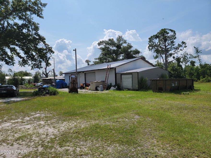 All sizes are apx/////Sellers state that this building was GRANDFATHERED and can be use for either warehouse space, or a cabinet shop.  Seller now has tools in the warehouse and will sale at right price---big lot 156x186--building has paint room, concrete floors, 1 bath (sink/and toliet) 2 Bay doors --40x50 building (Owner states its was Grandfather in, and county said new owner must come in a apply for it to remain commercial now zoned R2 which buyer could put duplex and or townhouses) city water is near and buyers  would need to hook up--presently owners  are sharing the water with the neighbors.