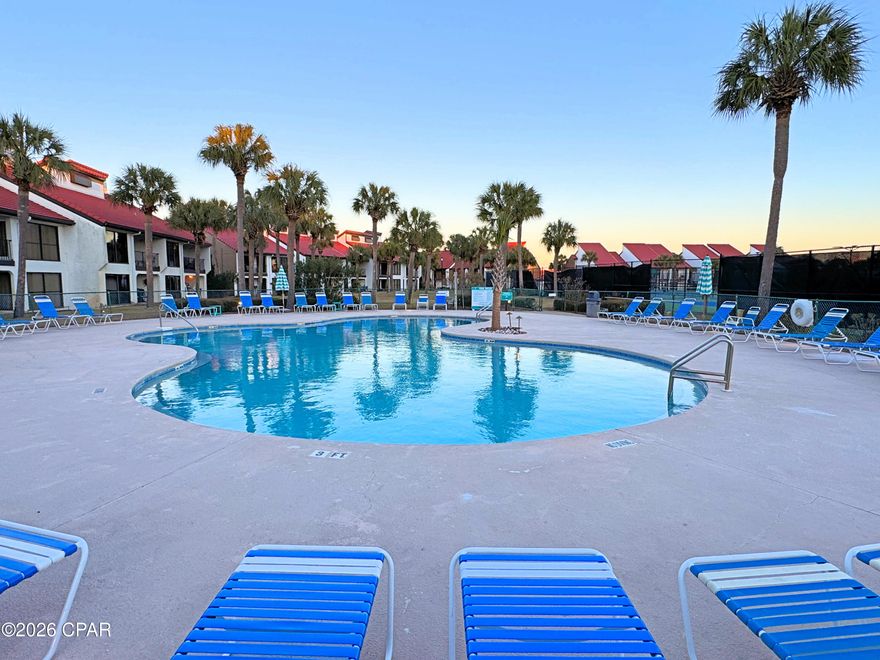 New Listing // No Stairs; just convenience!! A resort style condo for sale in the heart of Edgewater Beach & Golf Resort, Villa 2801 offers an updated interior and unbeatable access to the pool, pickleball, golf, tennis, beach and all of the exclusive amenities. This ground floor layout is an extra-large end unit with three bedrooms, featuring a living area with abundant natural light. Floor to ceiling sliding glass doors open to a covered patio and landscaped grounds, creating a peaceful indoor outdoor feel. The living area has nice tile flooring and a mirror wall that increases the sense of room size - see photos for modern update by framing! All three bedrooms are spacious, inviting, and functional. The owner's suite bathroom features a pretty tile shower with bench and niche, updated double vanity and mirrors, walk-in closet, and comfy carpet. The split floor plan puts the guest suite down the hall with its own bathroom and sliding glass doors. The third bedroom offers access to the guest bath and is used as an office by this owner who lives here. There is a full kitchen with granite countertops, beachy-look white cabinetry and appliances, breakfast bar, dining area, and a convenient in unit laundry. This is the seller's primary residence and the antiques in the photos do not convey. Alternative items will be substituted. With strong rental potential, a prime location near the heated pool and sports club, along with the privacy of the Villas, this iconic property is ideal as a vacation home or rental investment. Owning a Villa at Edgewater means embracing a lifestyle centered around relaxation, recreation, and convenience. Enjoy tropical pools, hot tubs, splash pad, golf, pickleball, tennis, fitness facilities, on site dining and market, and private beach access--all within a gated, beautifully maintained resort. A personal or rental retreat with definite lifestyle appeal!