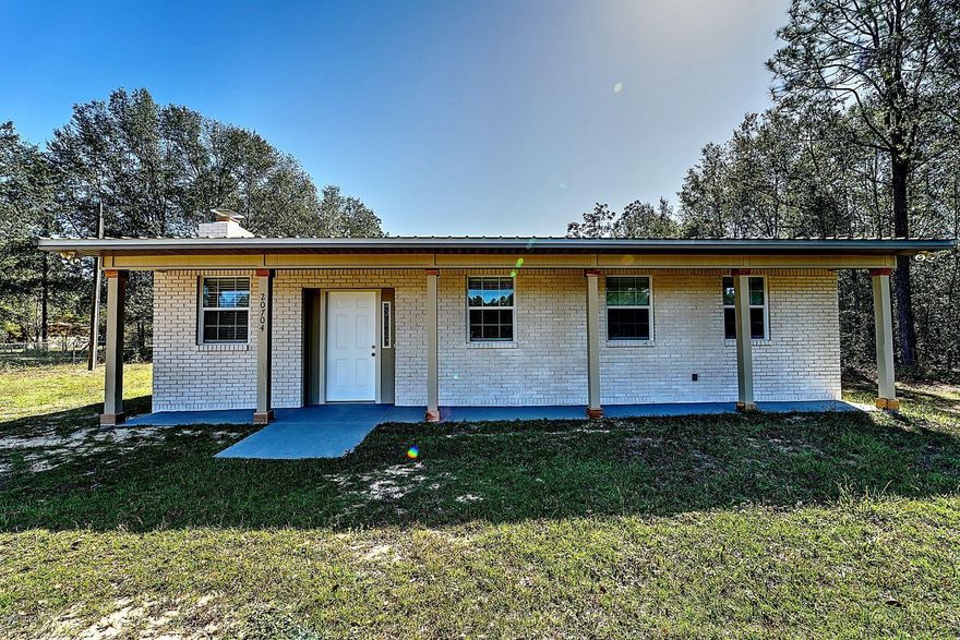 Nice country cabin located on Hwy 231. Home has been completely remodeled inside and out. Large brick fireplace. Comes with stainless steel appliances, new carpet in both bedrooms. Bathrooms have tile, thick laminate flooring throughout main room and kitchen. Kitchen has granite counter-tops. Full length front porch with a five by 16 back porch. Large piece of property so bring your horse. Ready to move in.