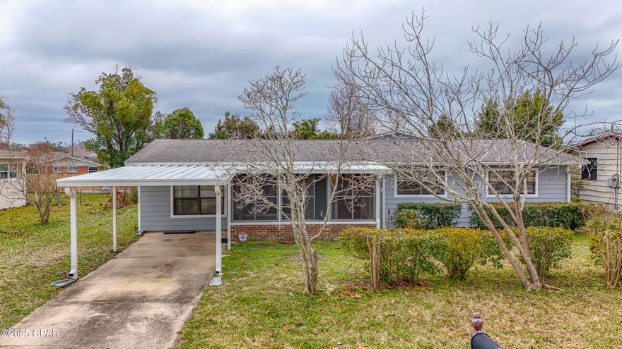 CURRENTLY UNDER CONTRACT, SELLER WILL CONSIDER BACKUP OFFERS. This property is situated in a highly desirable and established neighborhood. It is conveniently located within a mere 10 minutes from any point in the Panama City area. The home has been exceptionally well-preserved over the years and offers a surprisingly spacious interior. The kitchen is equipped with a new refrigerator, stove top, dishwasher, and microwave. The master bedroom features an ensuite bathroom and is notably large. The living room showcases a stunning wood finish. Additionally, the residence includes a formal dining room, a screened Florida room, and an enclosed mudroom at the entrance. The exterior boasts new Hardy Panel siding, and the roof was replaced in 2017. A sizable workshop/garage at the rear has also been newly sided, and there is a carport at the front. The property is equipped with gas, with the included dryer and hot water heater both connected to gas lines. This home offers an abundance of features at an attractive price point.
