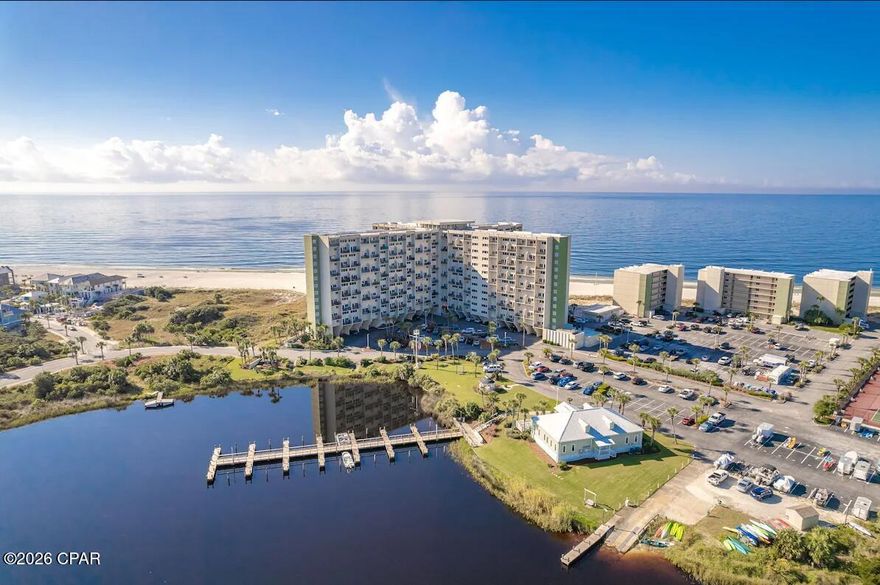 Welcome to Unit 913 at Pinnacle Port that  presents a rare, high-performing investment opportunity situated directly on the sugar-white sands of the Gulf of America within the gated Carillon Beach community. This fully renovated and professionally decorated 2-bedroom, 2.5 bathroom residence delivers immediate income and long-term value, with exceptional documented rental history for 2024 and 2025--and already completely booked for 2026, producing over $60,000 in secured rental income.Positioned to capture unparalleled panoramic Gulf views, this unit also offers the unique advantage of overlooking Lake Powell, one of the area's rare coastal dune lakes--creating a truly distinctive dual-waterfront backdrop that enhances both guest appeal and rental demand.Offered 100% turnkey, every detail has been thoughtfully curated, allowing for seamless ownership from day one. Whether utilized as a high-yield investment property or a private second home, this residence combines proven performance, future income security, and an irreplaceable beachfront location.An exceptional opportunity to acquire a fully stabilized, income-producing asset in one of the most sought-after coastal settings along the Gulf Coast. This opportunity comes along very seldom that has this kind of rental track record and also has you booked solid for 2026! This property offers an investor 100% confidence in their investment with a 9 month headstart on rental revenue in place. DO NOT LET THIS PROPERTY GET AWAY!