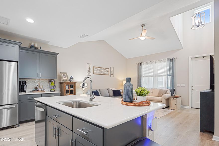 Carefree Coastal Living in Latitude Margaritaville Watersound! Welcome to the beautifully appointed Camellia Cottage, a perfect blend of comfort and style in one of the Gulf Coast's most sought-after 55+ communities. This charming home boasts a bright and airy great room with soaring cathedral ceilings and laminate flooring creating the perfect space to relax or entertain. The chef-inspired kitchen features elegant quartz countertops, a classic tile backsplash, upgraded electric range, microwave, and a large center island—ideal for casual dining or happy hour with friends. Just off the kitchen, a spacious dining area offers plenty of room for gatherings. Retreat to the spacious primary suite, complete with stylish tile flooring, a spa-like tile shower, dual quartz vanities, and a custom walk-in closet with built-ins for effortless organization. A comfortable guest bedroom and upgraded guest bath—with tile flooring, tile shower, and convenient grab bars—offer a welcoming space for visitors. Enjoy Florida's year-round sunshine from your private screened-in porch, the perfect spot for morning coffee or evening breezes.

Nestled within a vibrant golf-cart-friendly community with nearby trails and underpass access, this home offers the Margaritaville lifestyle at its finest—fun, freedom, and low maintenance. Your laid-back, luxury lifestyle awaits!

The amenities at Latitude Margaritaville Watersound offer a 2 story full service restaurant, resort style outdoor pool both overlooking the Intracoastal Waterway, A state of the art fitness center with an indoor lap pool and spa, fitness classes, water aerobics and more. Pickleball and tennis courts, a bandshell with a dance floor and music every Friday and Saturday night / activities year round. Kayak launch, game lawn with bocce ball, cornhole and ping pong. A theater, pet grooming, workshop and ceramics shop just opened. A future public marina and commercial area are planned with Publix grocery store, shopping and dining. 

This home has the builders Master Care warranty which in effect 2 years from original close date and a Builders 2/10 year structural warranty from the original build/close date. All lawn care is maintained by the HOA, exterior paint and roof replacement on a maintenance schedule are done by the HOA. Easy, carefree living! Must see this home and beautiful community! The lifestyle of this coastal Florida community awaits you!