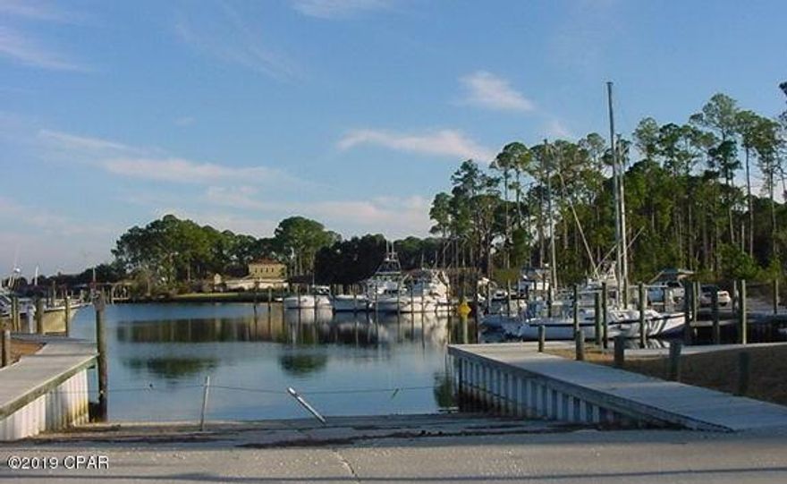 Looking to build a home in this beautiful community! Here is the opportunity!  This lot is located in the prestigious Gated, Bay Front, and Marina community of Dolphin Bay. The planned community has a deep-water marina with slips for rent or sale and a boat ramp for easy access to North Bay, the Inter-coastal waterway and the Gulf.  Fenced/lighted tennis courts are provided for the sports minded.  THE AMENITIES AND LOCATION OF THIS LOT CANNOT BE OVER STATED - Dolphin Bay is centrally located between the ''Beach'' and Panama City/Lynn Haven, with convenient access to the Navy base, beaches, schools, restaurants, shopping and entertainment venues.  Do not miss this PRICED TO SELL LOT!   All lot dimensions are approximate and should be confirmed by the prospective buyer prior to purchase.