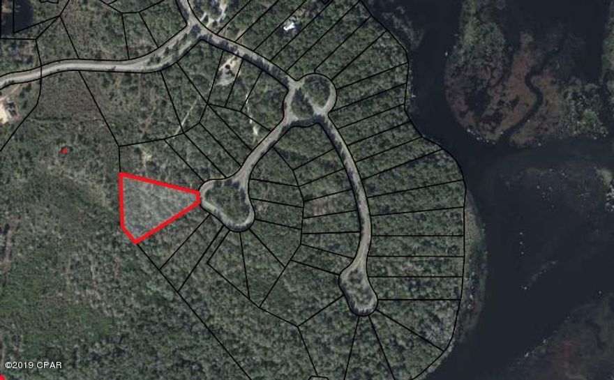 Here is your chance to build your dream home in one of Bay County's most exclusive gated neighborhoods.  Cedar Creek is in Southport, just 10-15 min north of Lynn Haven located on beautiful fresh water Deerpoint Lake.  This development is building out today with gorgeous high end homes, but you will also find all of the peace and quiet you are looking for in this beautiful wilderness.  Subdivision has pool, club house, play ground and lake access.  This lot is 2.25 Acres giving you plenty of room to build and still have privacy.  Located on a cul-de-sac.