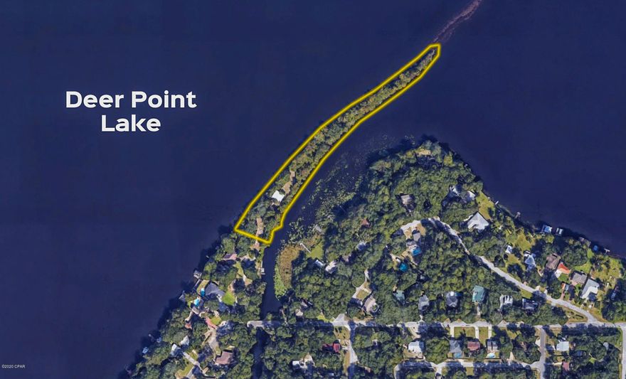 Perhaps the ONLY PENINSULA Available in the State of Florida! Located on Deer Point Lake. Picture building your dream home here. Take advantage of Approx 2.4 acres, 1.64 is build-able.  Lake views on one side and inlet on the other & several Mature Oak Trees. Enjoy privacy and the sounds of nature. The 2 story metal building, originally used to house a Pontoon Plane, is approx 1584 sq ft with a second floor office area.  Great storage for you boat, jet skis, RV, vintage cars or workshop ... Imagine the Possibilities! The lake is fed by Econfina Springs, which provides fresh drinking water for Panama City & surrounding area. Anglers can enjoy fly fishing for Blue Gill in the spring & Large Mouth Bass year round. There's plenty of Sunfish & Black Crappie too! Call for an appointment today!
