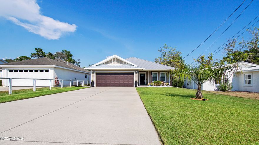 Immaculate beach home on the quiet West End. 3 bedrooms, 2 bath with a huge garage. Close to Lake Powell Boat ramp, minutes to Pier Park, and blocks to the beach. Stylish interior with granite tops, newer stainless appliances, and elegant lighting. Hurricane shutters, metal roof, brand new A/C and low-maintenance landscaping backyard retreat. Don't miss this rare opportunity! Brand new AC unit and kitchen appliances, owner-occupied but easy to show.