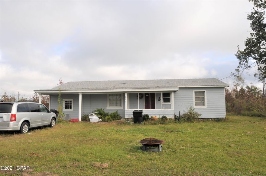 This home has a roof that is only 1 year old and had some repairs started will need some work to complete. This home has a very large lot 120x140. This home is priced to sell quickly. This would be a beautiful lot to build your dream home. Please verify all measurements if important.
