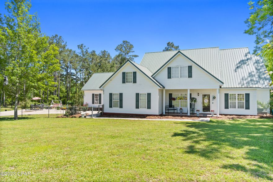 CURRENTLY UNDER CONTRACT, SELLER WILL CONSIDER BACKUP OFFERS.  Welcome to your dream home on Highway 2 in Graceville! This stunning 5 bedroom, 3 bathroom home boasts a spacious layout perfect for families or those who love to entertain. With over four acres of land, you'll have plenty of room to enjoy the great outdoors.

Inside, the home features a formal dining area and well-appointed kitchen.  There is also a beautiful office space, ideal for those who work from home or need a quiet space to study. The bedrooms are generously sized and offer ample closet space for all your storage needs. The bathrooms are modern and stylish, with high-quality fixtures and finishes.

Outside, you'll find a 2 car detached garage that provides plenty of room for your vehicles and additional storage. The property also boasts a variety of fruit trees and plants, including pear, peach, blueberry, apple, grape, fig, and mayhaw. Imagine being able to pick fresh fruit right from your own backyard!

The wildlife on the property is an added bonus, perfect for nature lovers and outdoor enthusiasts. Whether you're watching deer graze or birds chirping, you'll love the peaceful and serene atmosphere.

Don't miss out on the opportunity to own this incredible home on Highway 2 in Graceville. Book a viewing today and start living your dream life!