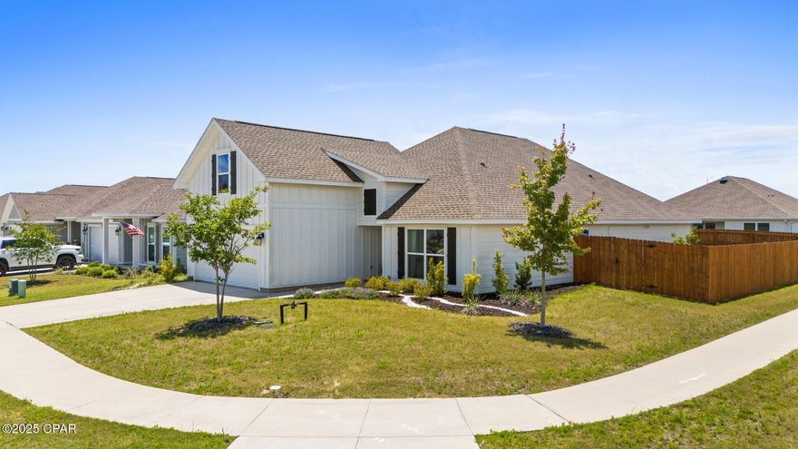 This beautifully maintained 2,665-square-foot, 5-bedroom, 4-bath home sits proudly on a manicured corner lot in a highly desirable sidewalk community. Built by Trueland Homes, this property showcases quality craftsmanship and attention to detail throughout.  Step inside to discover an inviting open floor plan with high ceilings, hard-surface countertops, and luxury vinyl plank flooring that flows seamlessly through every room. The well-designed layout is a rare find as three of the five bedrooms feature their own private baths, providing exceptional comfort and flexibility for family or guests.  The stunning kitchen offers an abundance of storage, a generous food pantry, a gas range, and a six-stage reverse osmosis water filtration system. A natural gas tankless, on-demand hot water heater provides endless hot water efficiently and economically.  Outside, the fully fenced backyard is a private oasis, featuring a variety of fruit trees including pomegranate, peach, orange, and banana as well as blackberry and blueberry bushes. Whether you're entertaining, gardening, or just relaxing, this outdoor space is a true retreat.  This exceptional property offers the perfect blend of comfort, efficiency, and charm and is ideal for a large or growing family seeking a move-in-ready home in a welcoming neighborhood.  Measurements are approximate.