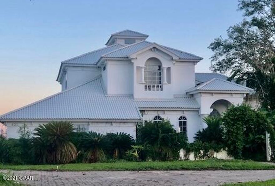 Exquisite Mediterranean styled waterfront home with unparalleled views of North Bay. This gracious estate home occupies a large 1.3 acre lot. Step into the magnificent entry featuring a beautiful staircase, oversized fireplace, and soaring ceilings with deluxe crown moldings. The kitchen area has large picture windows with bay views and high end appliances, leading to a family room with doors accessing the resort inspired pool and patio. The crowning jewel of this four bedroom three bath home is the third floor balcony which you can enjoy a spectacular sunset.