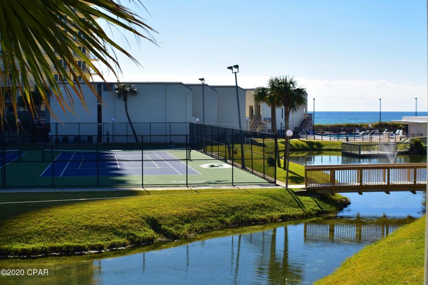 CURRENTLY UNDER CONTRACT, SELLER ACCEPTING BACKUP OFFERS. Great 3BR/3BA Sugar Beach condo with a pond and gulf view!  This unit is being sold furnished and even though the sellers don't rent it out, it is considered rental ready!  Great as a rental investment or use for your own personal beach getaway!  Can sleep 10-12 people!  The balcony off the living area offers the pretty water views while the balcony off the Master Bedroom has a little more privacy!   Sugar Beach amenities include a dedicated beach, barbecue grilling patios, tennis and shuffleboard courts, pool and clubhouse, and a great turtle/koi pond!  You're also walking distance to many restaurants and family-friendly activities!  All info is approx and must be verified by Buyers if important.