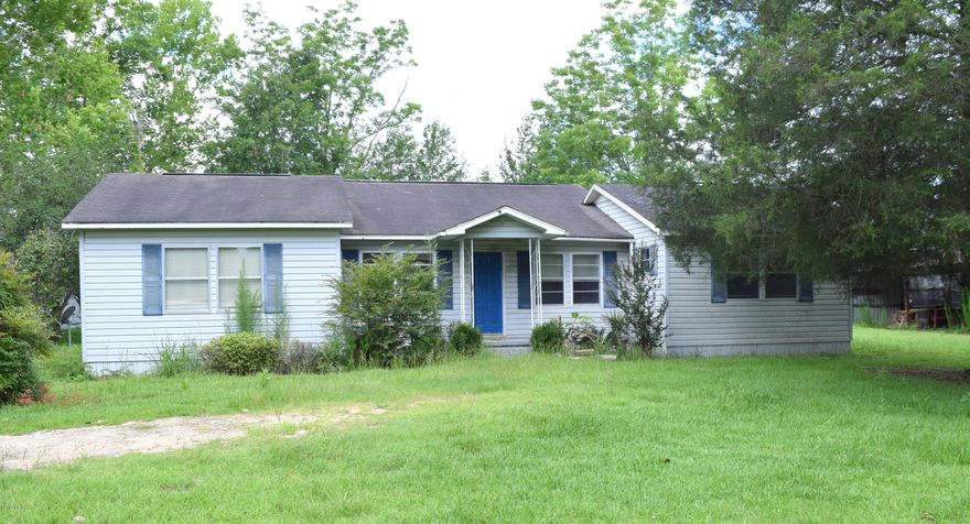 Great Investment opportunity! Located just south of Clayton Road on Hwy 77 this 3 bedroom 2 bath home is situated on more than 2 acres and features a split floorplan, spacious master suite, large additional bedrooms with walk-in closets and formal dining. House is in need of repairs but has great potential as a primary residence or investment.