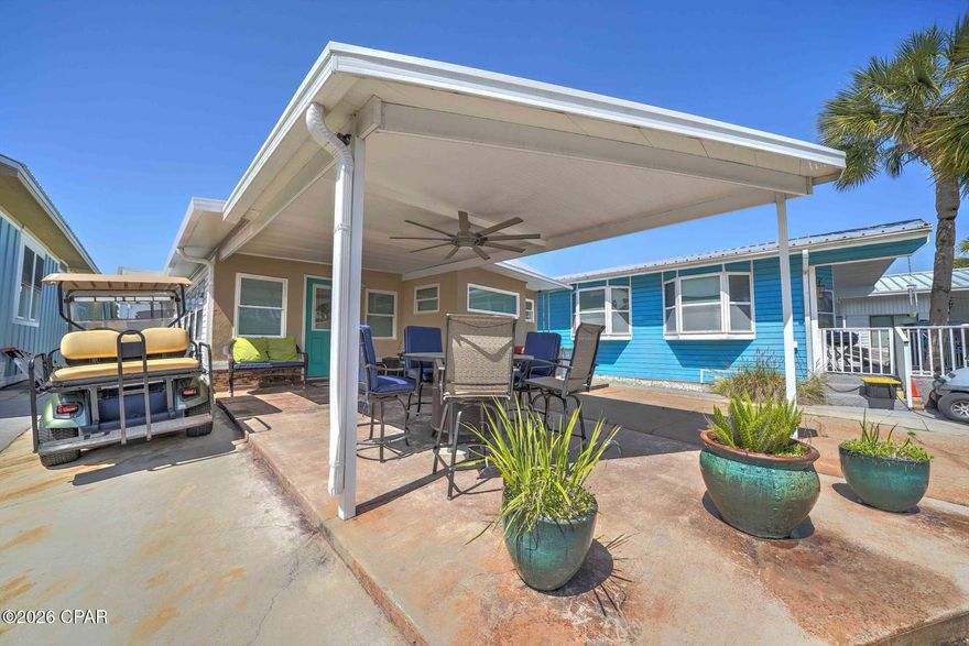 This charming 2-bedroom, 2-bath coastal retreat in the highly sought-after Venture Out community in Panama City Beach offers the perfect blend of comfort, convenience, and outdoor living. Ideally designed for beach living, the home features a spacious covered outdoor patio area that serves as an additional living and entertaining space. With ample room for outdoor dining, relaxing seating this inviting area is perfect for enjoying coastal breezes after a day at the beach.

Inside, the home welcomes you with a bright and inviting living area featuring coastal décor, goo natural light, and durable flooring. The open layout flows seamlessly into the kitchen and dining area, creating an easy space for gathering with family and friends. The kitchen offers generous cabinet storage, granite countertops, and a convenient breakfast bar for casual dining.

Both bedrooms are comfortably sized, while the two full bathrooms provide convenience for guests and family alike. Whether used as a personal beach getaway, full-time residence, or investment property, this home offers excellent versatility.

Located inside the gated Venture Out resort community, residents and guests enjoy an array of amenities including two swimming pools, a private beach access to the Gulf of Mexico, boat ramp with bay access, fishing pier, tennis courts, playground, and a vibrant golf-cart-friendly atmosphere. Venture Out remains one of the most desirable vacation and investment communities in Panama City Beach thanks to its unbeatable location between the Gulf and Grand Lagoon.

With its welcoming interior, spacious outdoor living area, and access to resort-style amenities, this 2-bedroom, 2-bath Venture Out property is the perfect opportunity to own a piece of the Panama City Beach lifestyle.