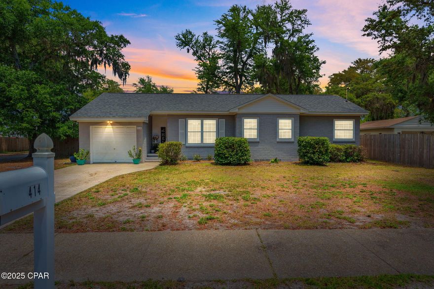 CURRENTLY UNDER CONTRACT-SELLER ACCEPTING BACK UP OFFERS. Nestled in the highly sought-after historic neighborhood of The Cove in Panama City, this beautiful, recently remodeled concrete block home blends timeless character with modern updates. Featuring original hardwood floors, quartz countertops, and stainless steel appliances, this 3-bedroom, 1-bath gem offers comfort, style, and flexibility in a prime coastal location. Step inside to find  a spacious living area, that flows seamlessly into the dining area and kitchen. The kitchen hosts stainless steel appliances, quartz countertops, plenty of cabinet storage and counterspace. The add-on space in the rear of the home accessed through the kitchen brings an additional 211 sqft to the total home square footage that offers incredible flexibility and can easily serve as a second living area, home office, or even potential to be a primary suite.  A gorgeous heated and cooled Florida room with vinyl plank flooring, overlooking the backyard, bathed in natural light thanks to walls of windows, is perfect for relaxing, entertaining, or indoor gardening. Three bedrooms are in the heart of this cozy home, along with one bathroom. Enjoy the privacy of this home situated on a corner lot, with a privacy-fenced backyard, and a large storage shed with electricity, perfect for your golf cart, beach gear, or outdoor equipment. A 1-car garage adds convenience and extra storage space, while mature landscaping enhances curb appeal. Enjoy the laid-back Cove lifestyle with water access less than a half mile away, and explore the neighborhood via bike or golf cart with three parks nearby, including a brand-new bayfront park just minutes from your door. You're also only 6 minutes to downtown Panama City's shopping, dining, and events, and 10 minutes to a beach access on the bay, giving you the best of both worlds. This home has been priced below independent appraisal, offering excellent value to homeowners. Schedule your private showing today and experience the charm of The Cove for yourself!