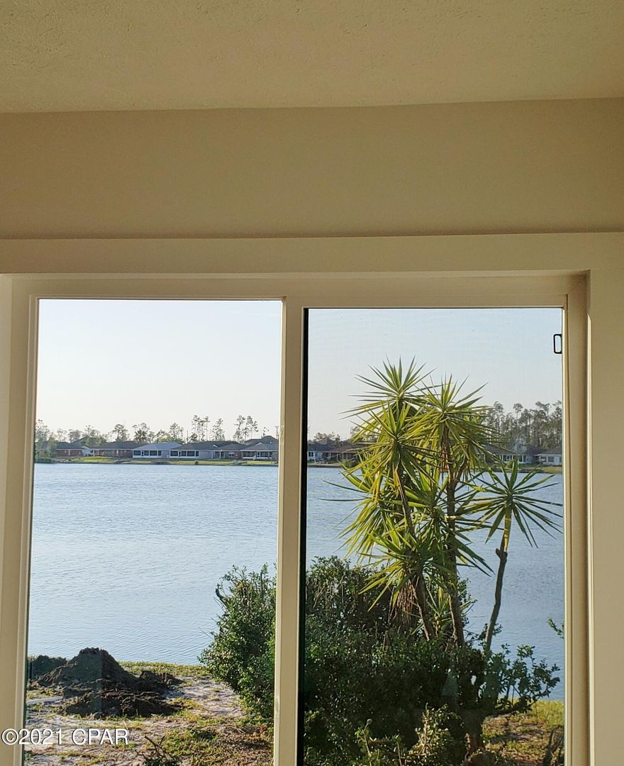 CURRENTLY UNDER CONTRACT, SELLER ACCEPTING BACKUP OFFERS' Waterfront beautiful 2 bedroom, 2 bath with loft townhome has a great view out over the lake from the living/dining/kitchen/loft and the master bedroom.  Fun lifestyle to have access to lake for paddle boarding , kayak, swim or just a lazy day for floating.  New appliances, floors, cabinets, lighting, plumbing fixtures, mirrors, windows, doors, HVAC and baseboards. Some new sheetrock with all new interior paint. Roof installed in 2017. 

Open floor plan with 2 story ceilings in living area makes it feel much larger. End unit gives you a little more privacy. Yard currently being spruced up.

Just a few blocks from shopping, medical facilities & churches.  Ready for you to move in. New pictures forthcoming when construction is complet