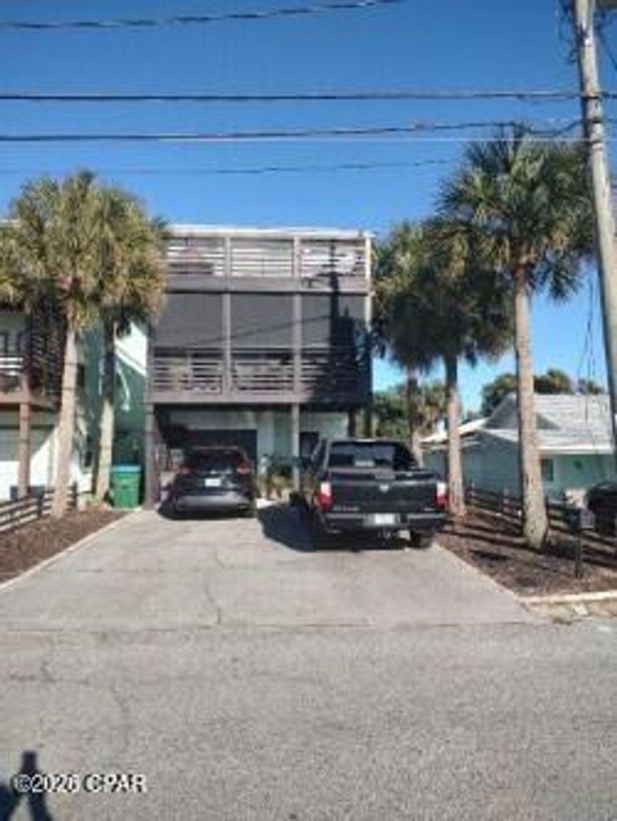 Great investment opportunity on the beach! Spacious four bedroom, four bath home located just one block north of Front Beach Road. Enjoy gulf views from all three balconies or take a quick walk to the beach. Walking distance to several restaurants and bars. First-floor features one car garage and one bedroom with efficiency kitchen and full bath, perfect for separate rental. Second and third floors offer more oversized living areas, fresh paint in 2022 inside and out, new vinyl floor in 2021, sliding glass doors to balconies, granite countertops, breakfast bar, and third-floor master bedroom with gulf views. Electric shades on second floor balcony. Privacy railings on 1st and 2nd Floors.  Can see fireworks from both piers (County and Pier Park) from 3rd Floor Balcony.  Fantastic opportunity to live one block from the beach for an affordable price! Low maintenance costs and no HOA.  Current Termite Bond with Arrow Pest. Home being sold in its as-is condition. All measurements and dimensions are approximate. More pictures provided upon request.