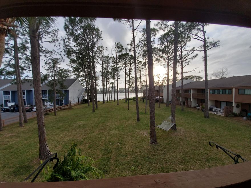 For rent! Beautifully furnished 2 BR, 2 BA condo at The Palisades with gorgeous water views of Grand Lagoon. Conveniently located near the Navy base, grocery and local restaurants; The condo was updated with an open concept kitchen, stainless appliances and breakfast bar. The master bedroom boasts a king bedroom suite with new memory foam king mattress, dresser and flat screen tv. Attached bathroom with tub/shower combination; Split floor plan; Spacious second bedroom with queen posture-pedic bed, matching armoire, and wall-to-wall closet space; Updated hallway bath with tile shower; Washer/Dryer included! **Rent includes water, sewer, basic cable, garbage. **Pets negotiable upon approval with $500 non-refundable pet fee.