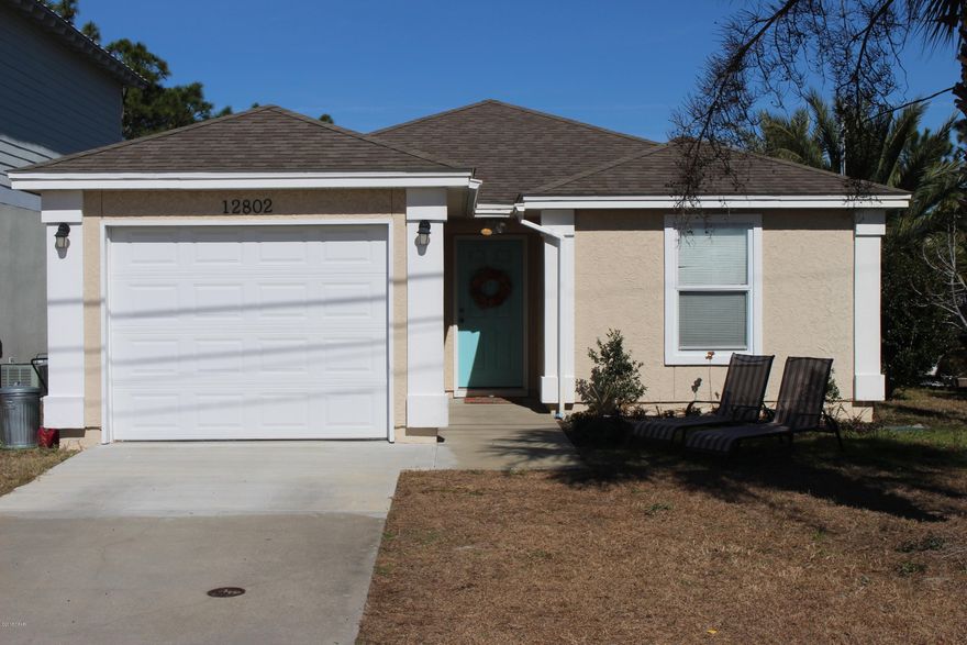 Exceptional location within a few minutes to the beach! 3 Bedroom 2 Bath with updated quartz countertops throughout, updated kitchen, and new tile floors throughout. New HVAC in the past 4 years. 5 acre lake behind the property utilized by owners in the are for fishing, kayaking, etc...The home features a vaulted ceiling in living room, open concept dining, kitchen, living. Covered back porch, 1 car attached garage, and new paint throughout. Setup your viewing today!