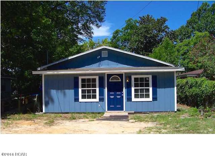 Charming cottage tastefully renovated top to bottom. Replaced rafters, roof, and newly painted siding. Everything is new in the bathroom: tile, fixtures tub and sink w/cabinet. New kitchen cabinets installed, new countertops, sink and fixtures. Cement flooring stained and polished throughout the home and is very attractive. Home is cinder block, which keeps the home cool in the summer and warm in the winter; should keep utilities at a minimum also. A large sunroom is located at the entrance & large open living, dining, kitchen area. All interior walls, trim and ceilings newly painted, all new windows installed. There are new electrical outlets, new electrical wiring and new plumbing. New lighting fixtures and fans. Existing ADT security can be reconnected. A large backyard. quiet neighborhood with low traffic flow.