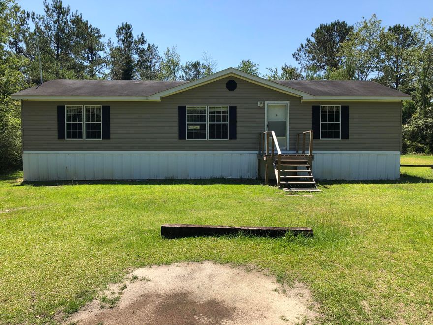 Secluded in the country is this 3/2 Double Wide on Approx 5.5 acres (mol) to be surveyed.  Split bedroom design makes family living comfortable and enjoy a large living area.  Spacious laundry/ utility rm. Close proximity to Chipley, 45 min dr to Panama City Fl or , Dothan Al.  Approx 5 min to I-10 and Falling Waters State Park.  New private road to be installed before closing. Make an Appt today.