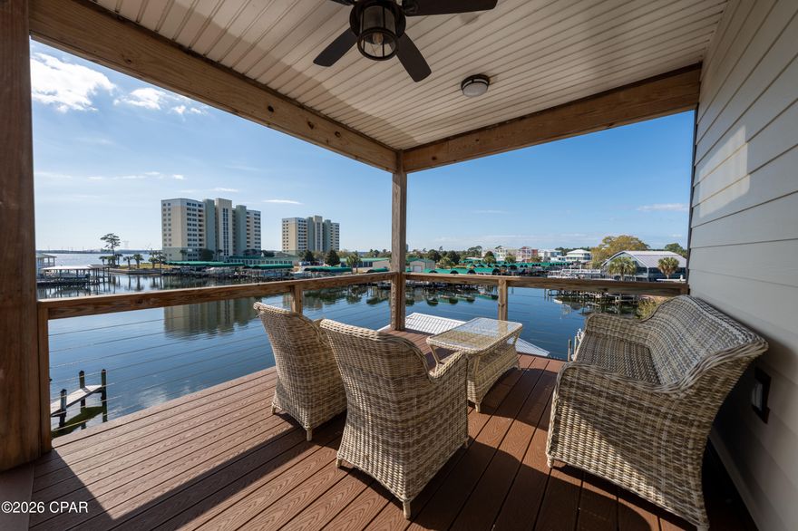 Welcome to 6215 Big Daddy Drive. This beautifully furnished waterfront retreat offers the best of coastal living and modern comfort. A fully decorated 3-bedroom, 3-bath, two-story home features charming coastal d�cor throughout and incredible views of the water by day and glowing Hathaway Bridge by night. Enjoy direct canal access that leads straight to the Gulf, complete with your own private dock for easy boating and fishing adventures. Relax on one of the two spacious balconies while taking in the serene water views or unwind in the comfy indoor spaces designed for both style and relaxation. The huge garage provides plenty of room for vehicles, storage, or water toys. Whether you're looking for a vacation getaway, an investment property, or your forever home, this move-in-ready waterfront gem has it all.