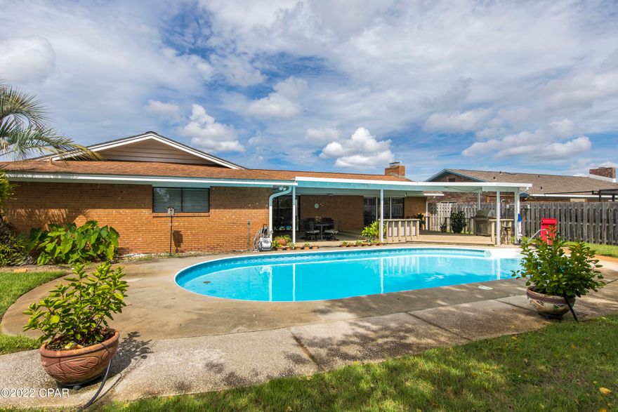 This lovely brick home has a spectacular outdoor entertainment space with a saltwater POOL, a hot tub, a large covered back porch and a storage building for your extra storage needs. All a bonus to this updated 4 bedroom, 2 bath home!  The updates include  the kitchen with beautiful custom cabinets, granite counter tops, and new stainless steel appliances. The breakfast area offers a buffet and built in cabinets for more kitchen storage. The large open family room boast vaulted ceilings with engineered wood flooring and a fireplace. Both master and additional bathrooms have been updated with new cabinets and quartz countertops. New paint, trim, lights and fans throughout the home. New carpet in the 3 additional bedrooms. Garage, sprinkler system, fenced yard, storage building and much more! This home is centrally located to town and is conveniently located to restaurants, shopping, hospital, medical offices, only a 20 min drive to the beach and approximately a 20 min ride to TAFB! Call today to schedule your showing appointment!!