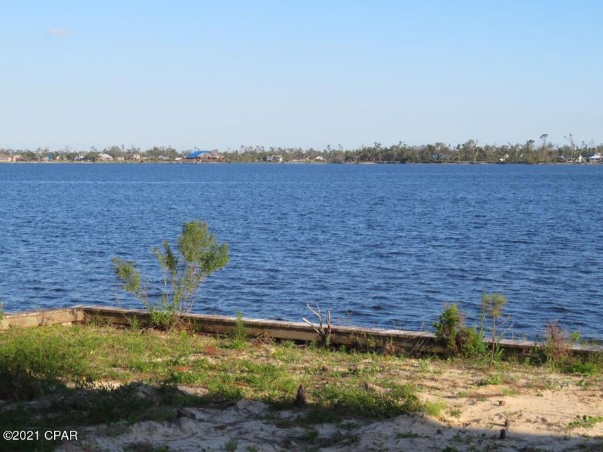 Beautiful Open Water View facing the South, on a finished and cleared LOT, that also has a seawall completed and in Place. Lot has already had dirt added and is ready to go to build your New Dream Home. Just a short boat ride to the Gulf and Open water in the Bay.